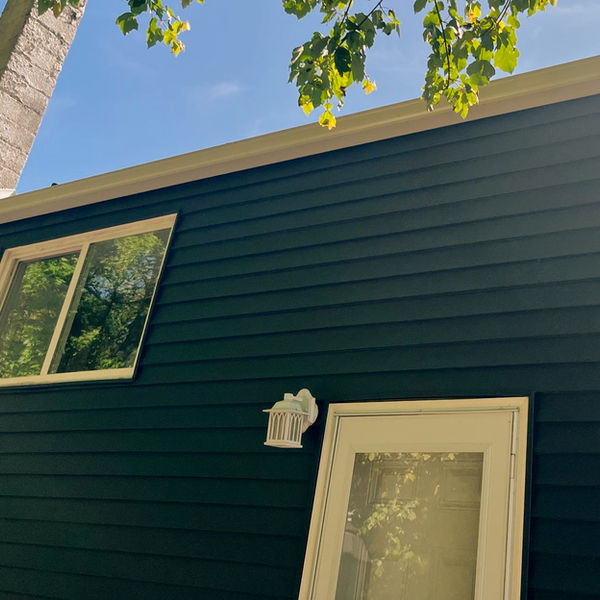 Vinyl siding on a home in St. Louis installed by Barry's Gutter and Home Repair