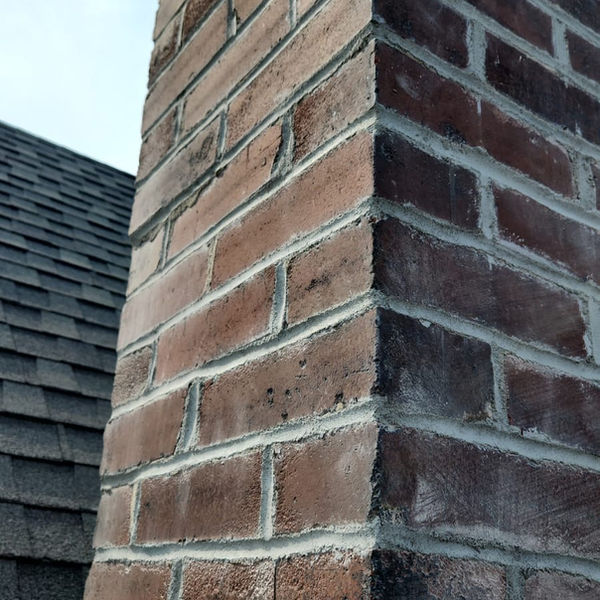 Tuckpointed chimney in St. Louis, MO by Barry's Gutter and Home Repair